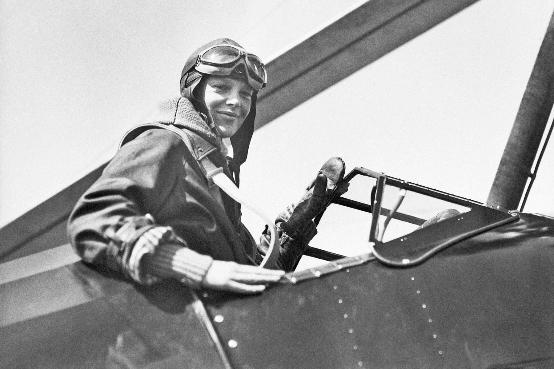 Amelia Earhart in airplane cockpit