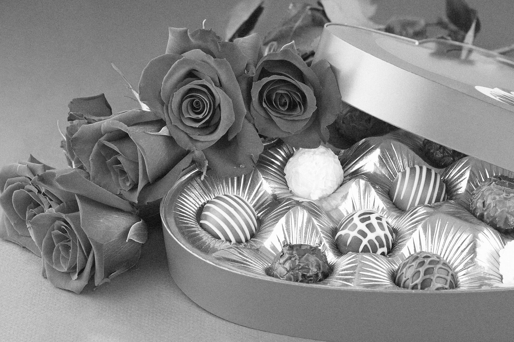 Box of chocolates and red roses