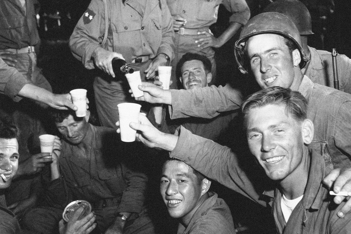 Soldiers sharing a drink