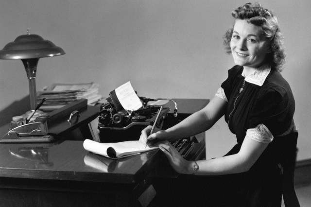 Secretary sitting at desk