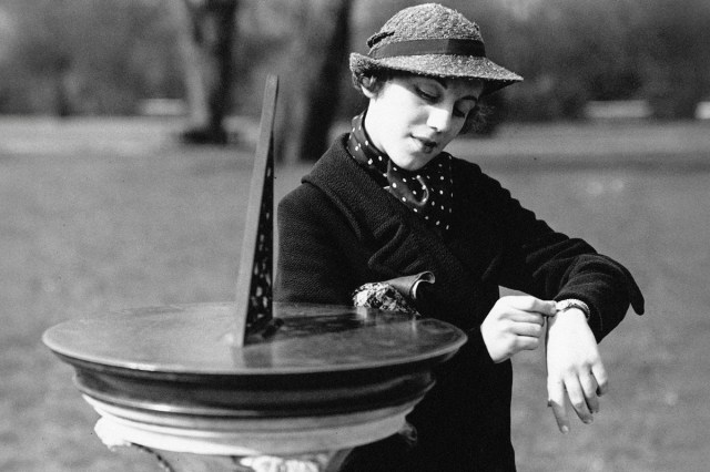 Woman checks her watch, 1936