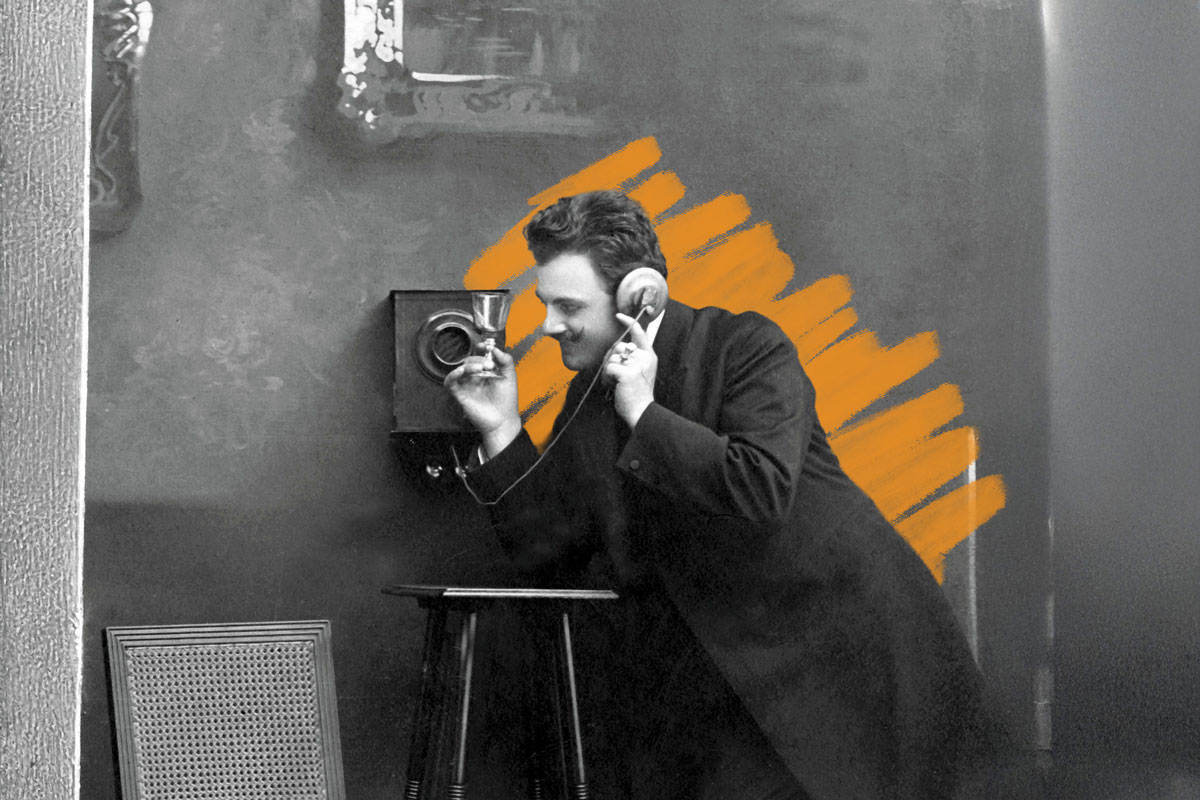 Man using telephone, circa 1915